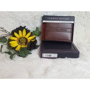 Men's Brown Tommy Hilfiger wallet with valet and RFID protection.